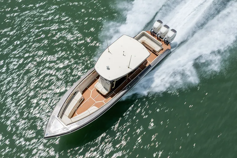 Slide: The Image of Aerial view of 2015 Statement 380 Open boat speeding on water. - 15