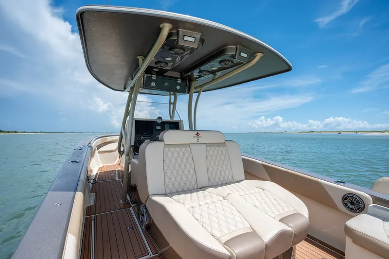 Slide: The Image of Luxury 2015 Statement 380 Open boat interior with plush seating on calm waters. - 24