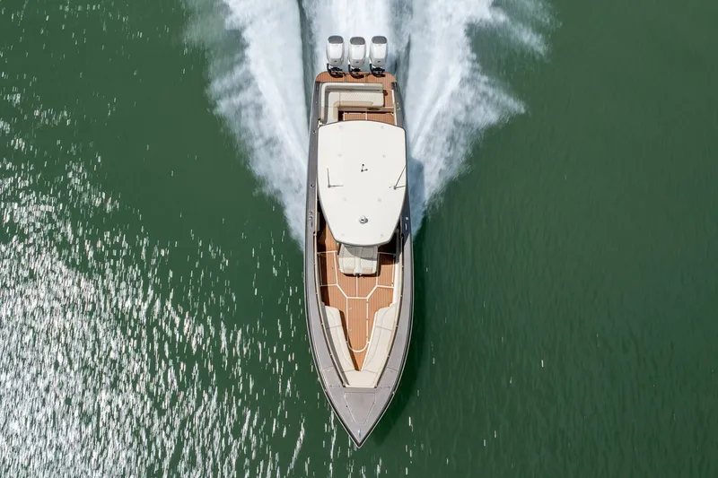 Slide: The Image of Aerial view of 2015 Statement 380 Open boat speeding on water. - 14