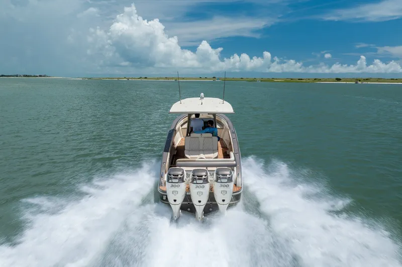 Slide: The Image of 2015 Statement 380 Open boat cruising on open water under a clear blue sky. - 17
