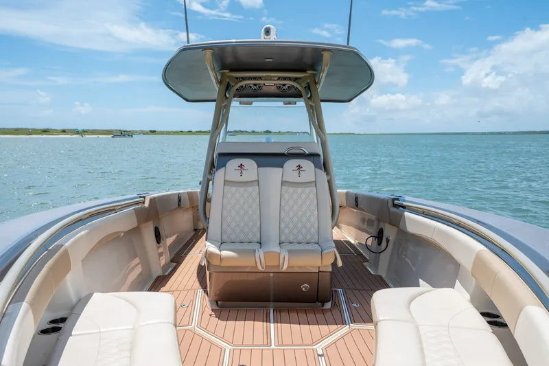Slide: The Image of Luxury 2015 Statement 380 Open boat interior on calm water, featuring elegant seating. - 30
