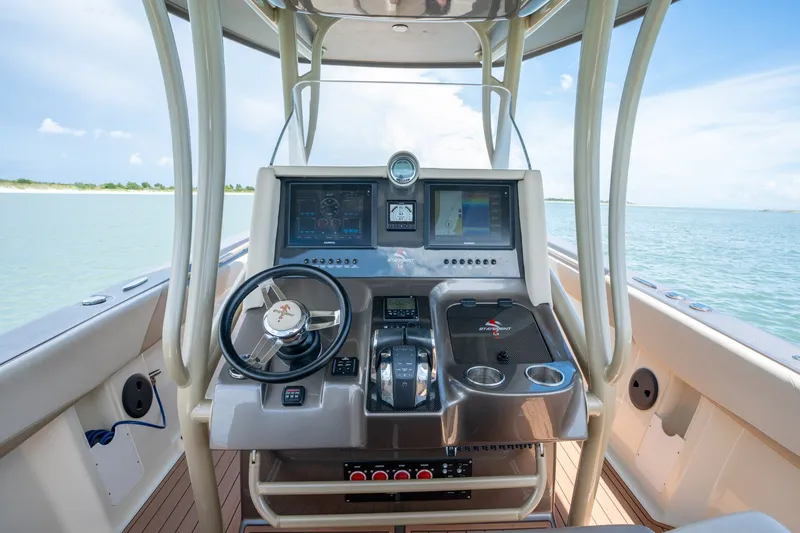 Slide: The Image of Cockpit of 2015 Statement 380 Open boat with modern navigation controls and steering wheel. - 8