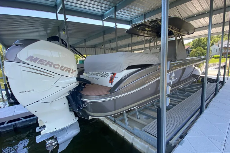 Slide: The Image of 2015 Statement 380 Open boat with Mercury Verado engine in covered dock. - 1