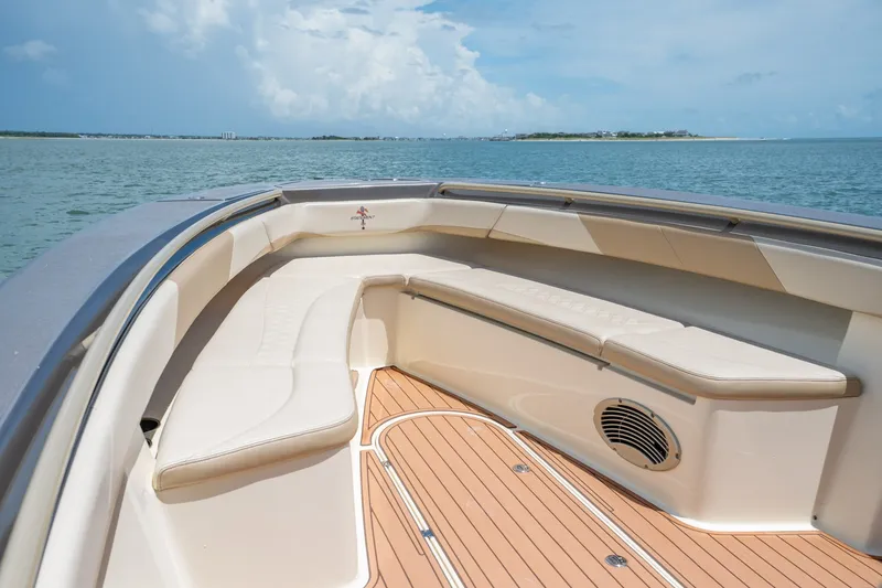 Slide: The Image of 2015 Statement 380 Open boat interior with cushioned seating and ocean view. - 10