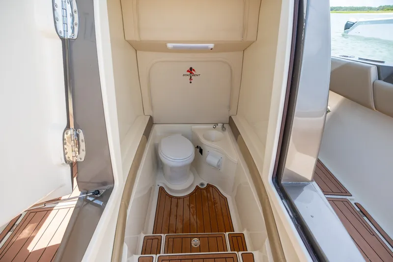 Slide: The Image of Interior view of 2015 Statement 380 Open boat bathroom with wooden flooring. - 34