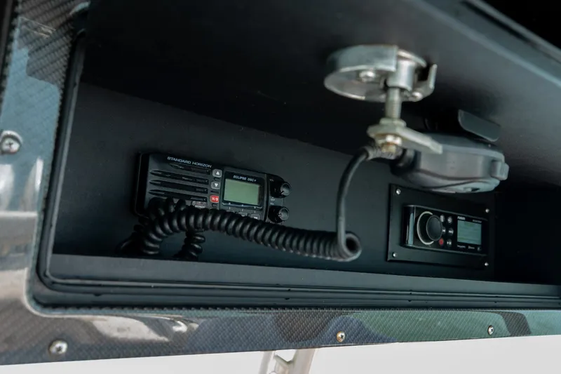 Slide: The Image of 2015 Statement 380 Open boat dashboard with communication equipment and controls. - 37