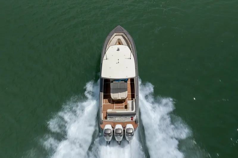 Slide: The Image of Aerial view of 2015 Statement 380 Open boat speeding on water. - 22