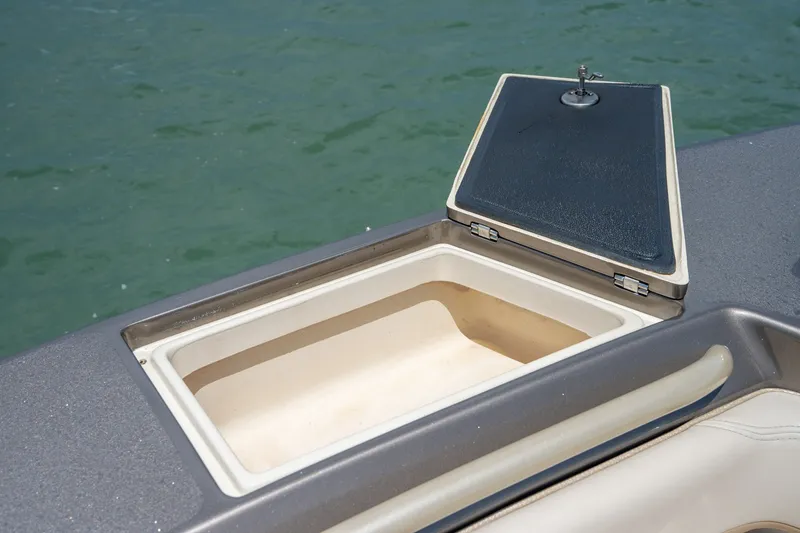 Slide: The Image of Open storage compartment on 2015 Statement 380 Open boat, with water in the background. - 31