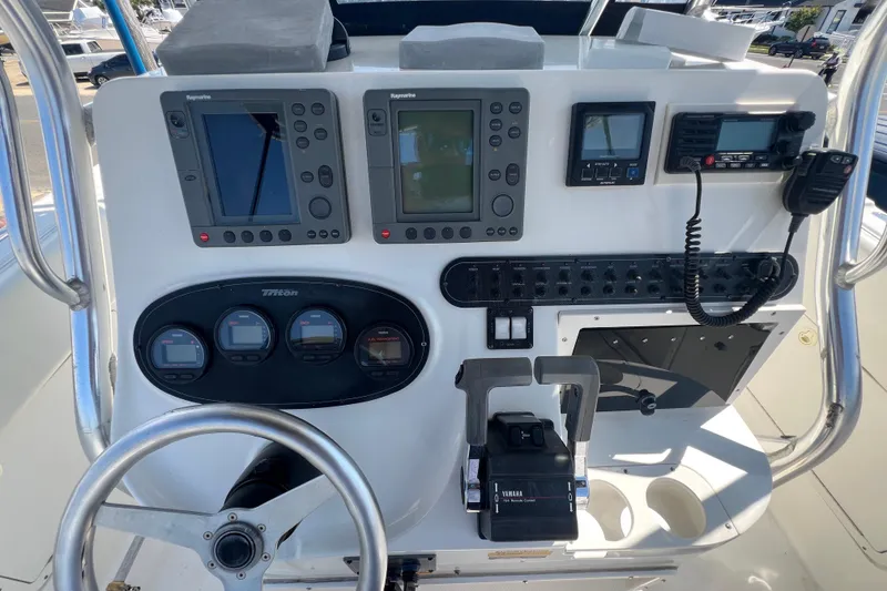 Slide: The Image of Control panel of a 2002 Triton 2895 CC boat with navigation and communication equipment. - 22