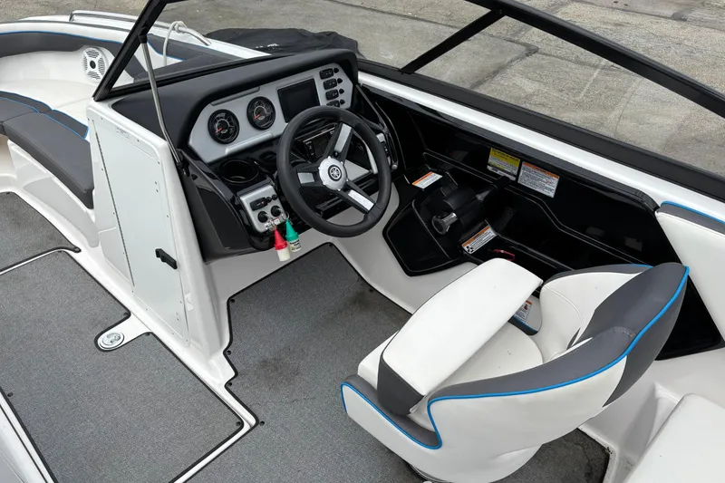 Slide: The Image of 2020 Yamaha Boats AR210 cockpit with steering wheel and seating. - 4