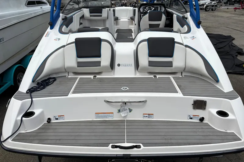 Slide: The Image of 2020 Yamaha Boats AR210, rear view showcasing seating and deck layout. - 9
