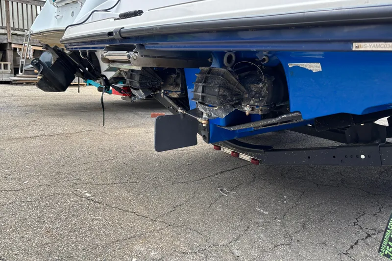 Slide: The Image of Rear view of a 2020 Yamaha Boats AR210, showcasing dual jet drives on a trailer. - 12