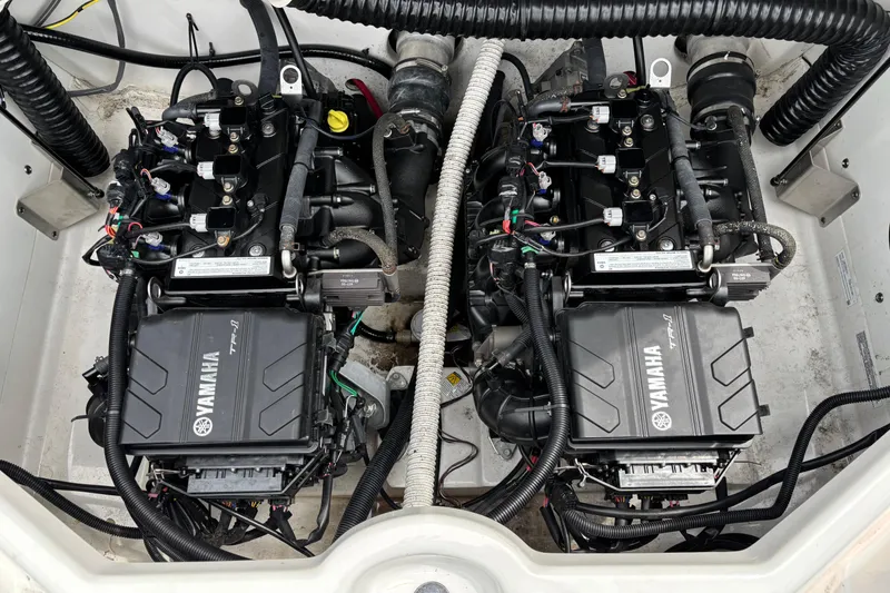 Slide: The Image of Twin Yamaha TR-1 engines in a 2020 Yamaha Boats AR210, showcasing detailed engine components. - 8