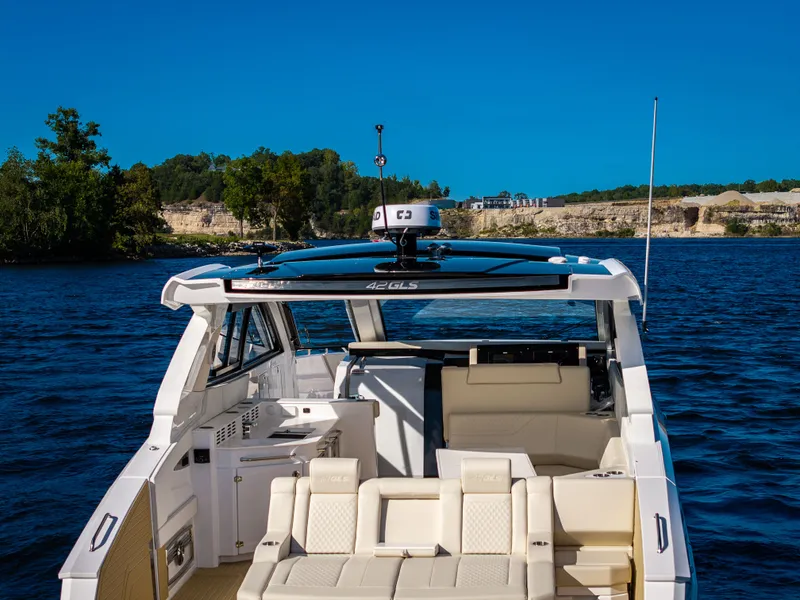 Slide: The Image of The image shows a luxurious 2027 Cruisers Yachts 42 GLS on calm waters. - 35