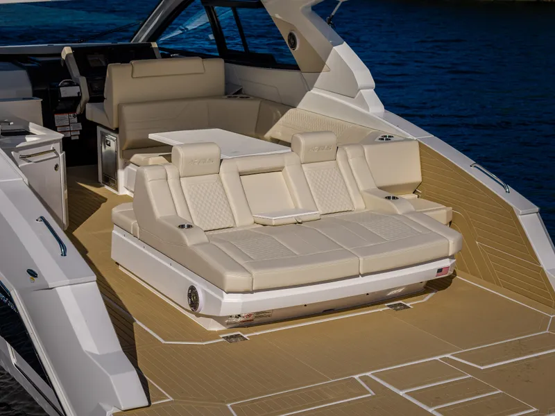 Slide: The Image of The image shows the deck of a 2027 Cruisers Yachts 42 GLS with sleek seating. - 28