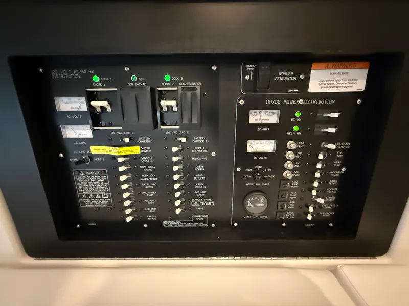 Slide: The Image of The image shows an electrical control panel on a 2027 Cruisers Yachts 42 GLS. - 47
