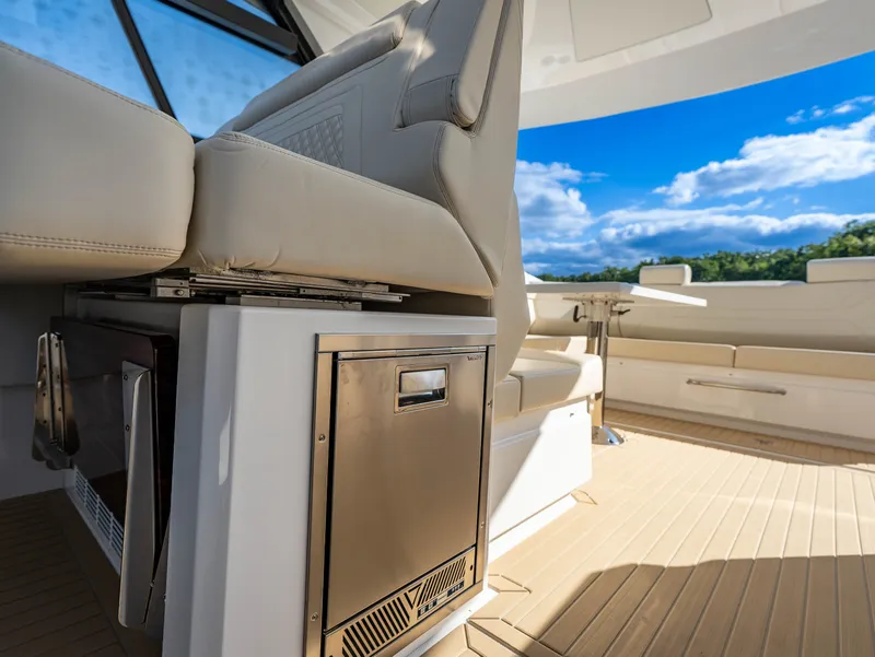 Slide: The Image of Interior of a 2027 Cruisers Yachts 42 GLS with sleek seating and a table. - 41