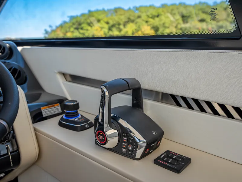 Slide: The Image of The image shows the helm of a Cruisers Yachts 42 GLS with modern controls. - 48