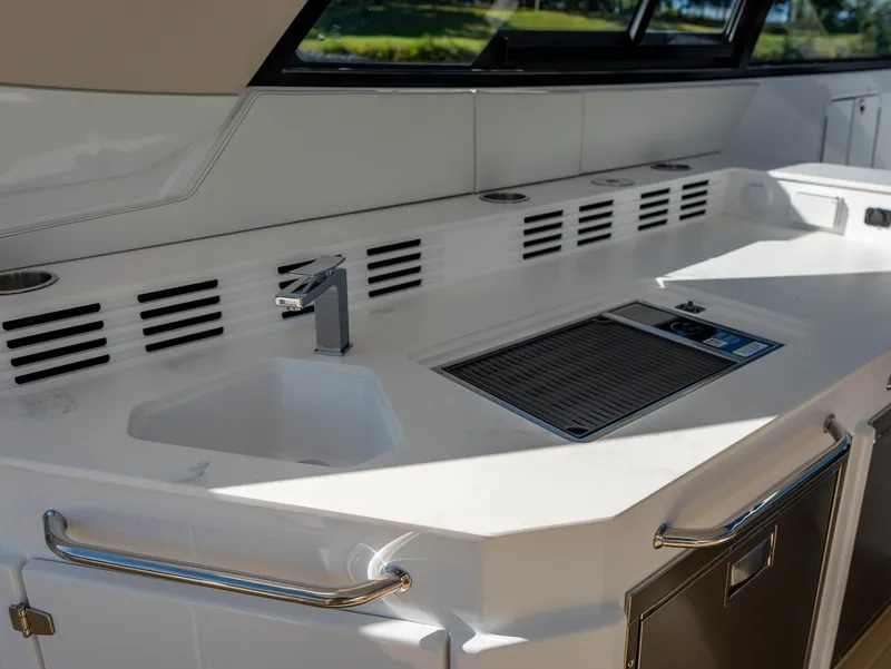 Slide: The Image of The galley on the 2027 Cruisers Yachts 42 GLS features a modern sink and countertop. - 40
