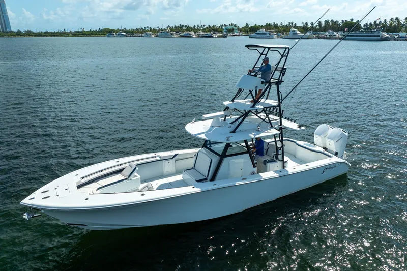 Slide: The Image of 2022 Yellowfin 39 Offshore boat cruising on a sunny day in open waters. - 2