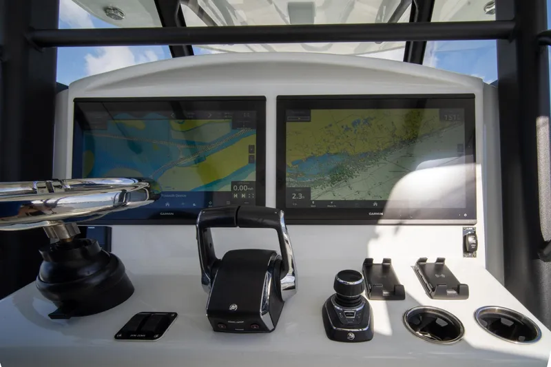 Slide: The Image of 2022 Yellowfin 39 Offshore helm with dual Garmin displays and controls. - 24