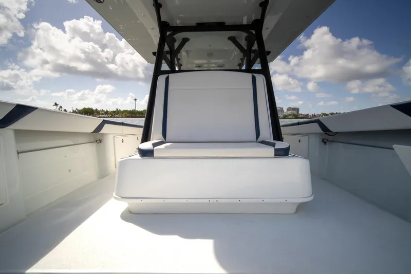 Slide: The Image of 2022 Yellowfin 39 Offshore boat interior with seating, under a clear blue sky. - 28