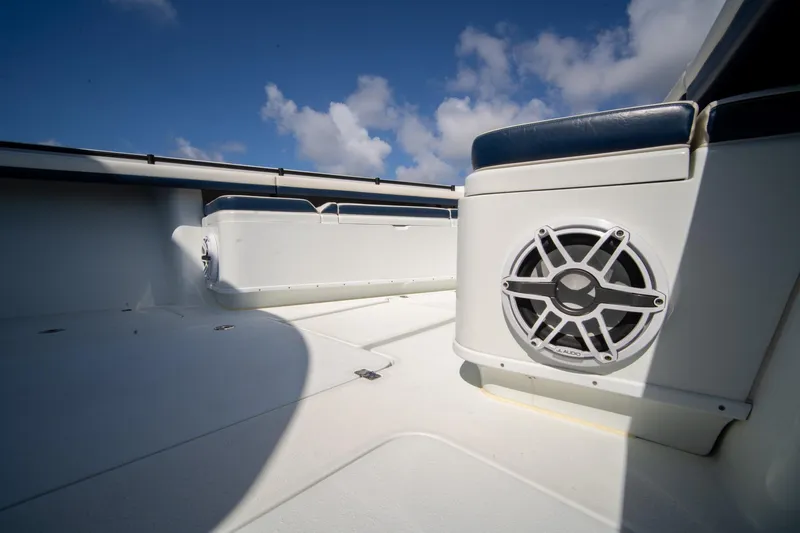 Slide: The Image of 2022 Yellowfin 39 Offshore boat interior with speaker, under a clear blue sky. - 22