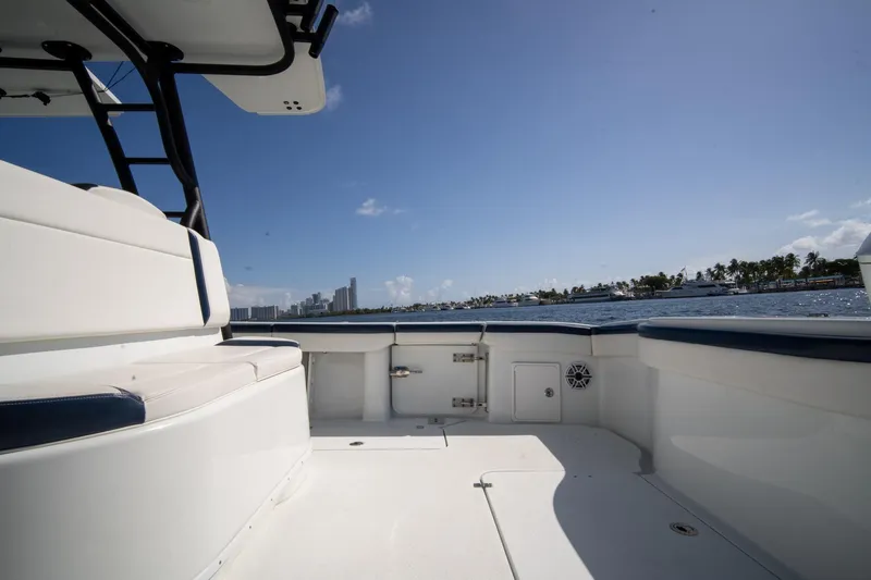 Slide: The Image of 2022 Yellowfin 39 Offshore boat interior with ocean and city skyline view. - 18