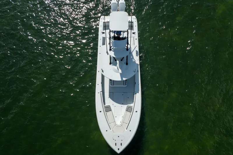 Slide: The Image of Aerial view of 2022 Yellowfin 39 Offshore boat on green water. - 31