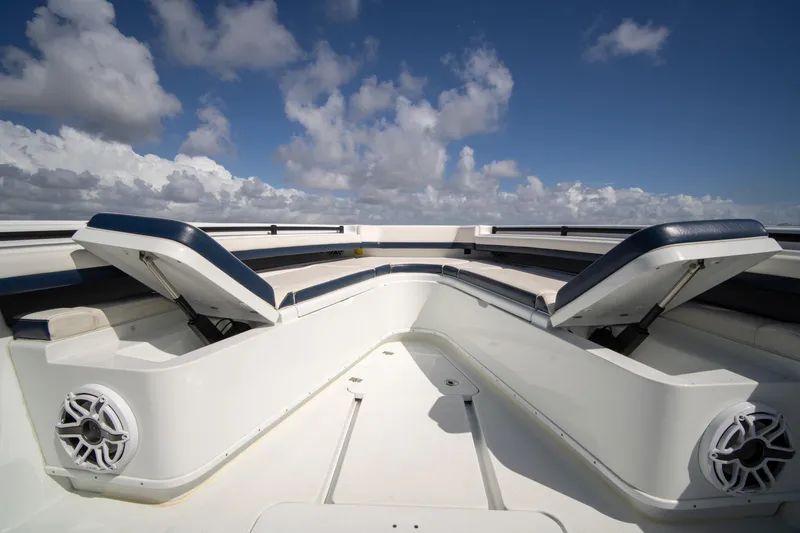 Slide: The Image of 2022 Yellowfin 39 Offshore boat interior with open seating under a blue sky. - 27