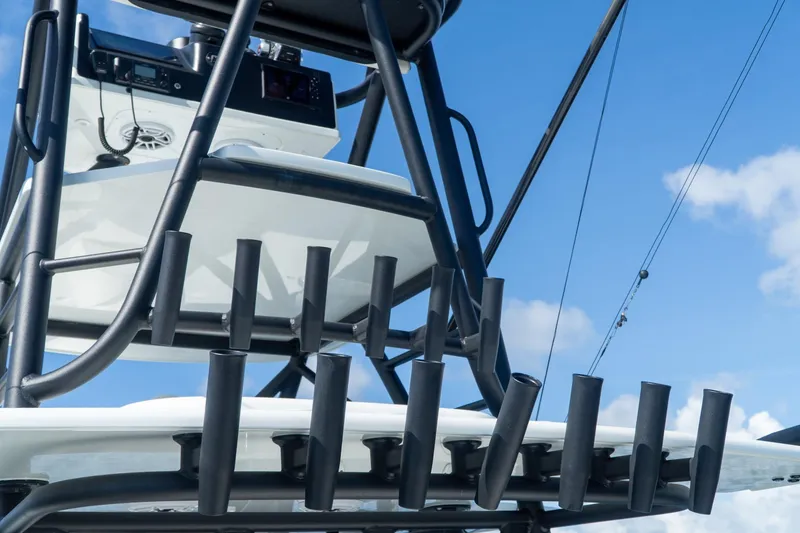 Slide: The Image of 2022 Yellowfin 39 Offshore boat tower with rod holders against blue sky. - 15