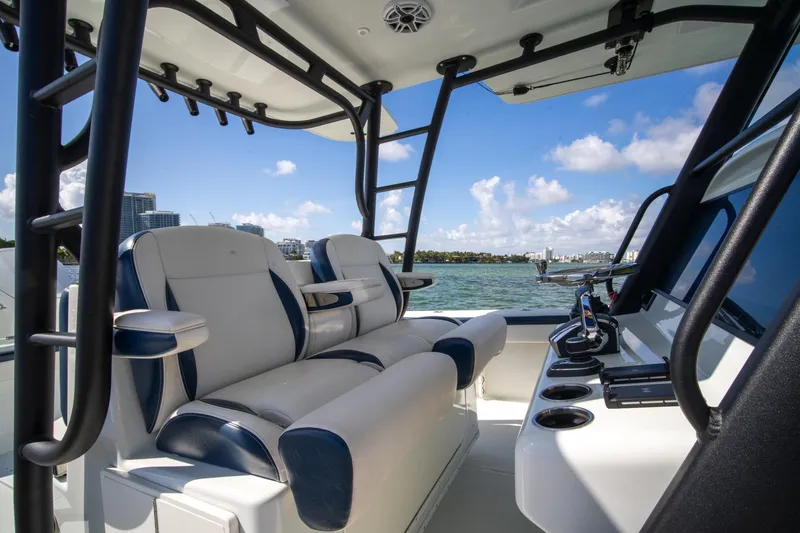 Slide: The Image of 2022 Yellowfin 39 Offshore boat interior with luxurious seating and ocean view. - 17
