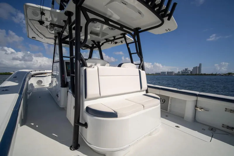 Slide: The Image of 2022 Yellowfin 39 Offshore boat interior with city skyline in background. - 9