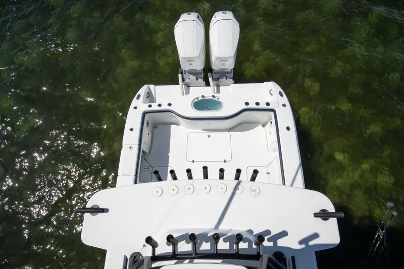 Slide: The Image of Top view of 2022 Yellowfin 39 Offshore boat with dual engines in clear water. - 35