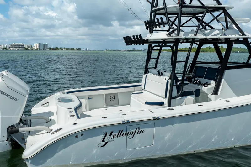 Slide: The Image of 2022 Yellowfin 39 Offshore boat on water, featuring sleek design and powerful Mercury engine. - 4