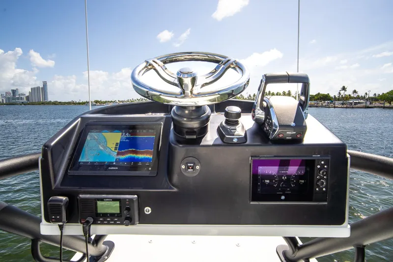 Slide: The Image of Helm of 2022 Yellowfin 39 Offshore boat with navigation displays and controls. - 11