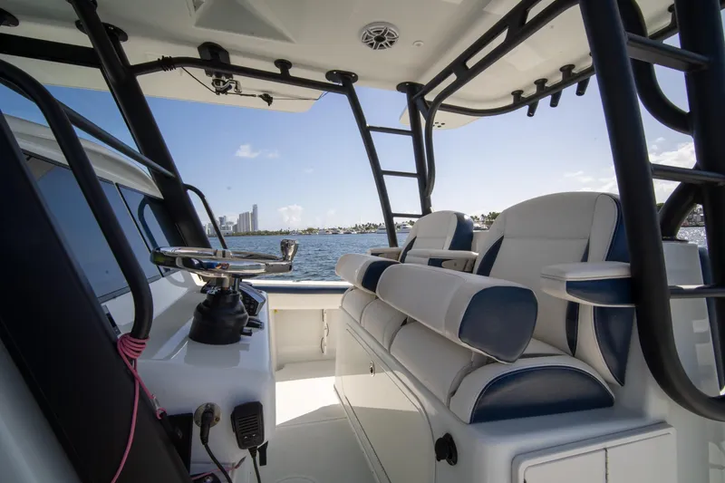 Slide: The Image of 2022 Yellowfin 39 Offshore boat interior with seating and ocean view. - 5