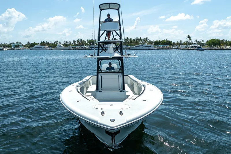 Slide: The Image of 2022 Yellowfin 39 Offshore boat cruising on a sunny day, featuring a tower and spacious deck. - 33