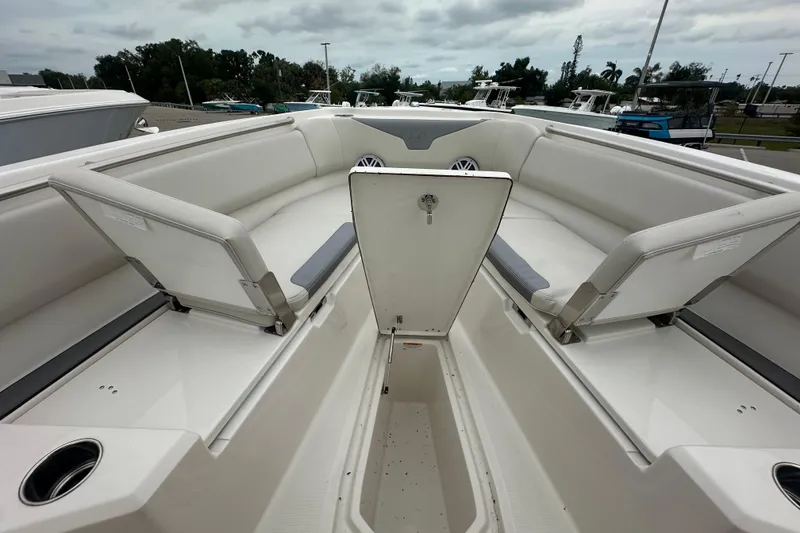 Slide: The Image of 2026 Sailfish 232 CC boat interior with spacious seating and storage compartments. - 21