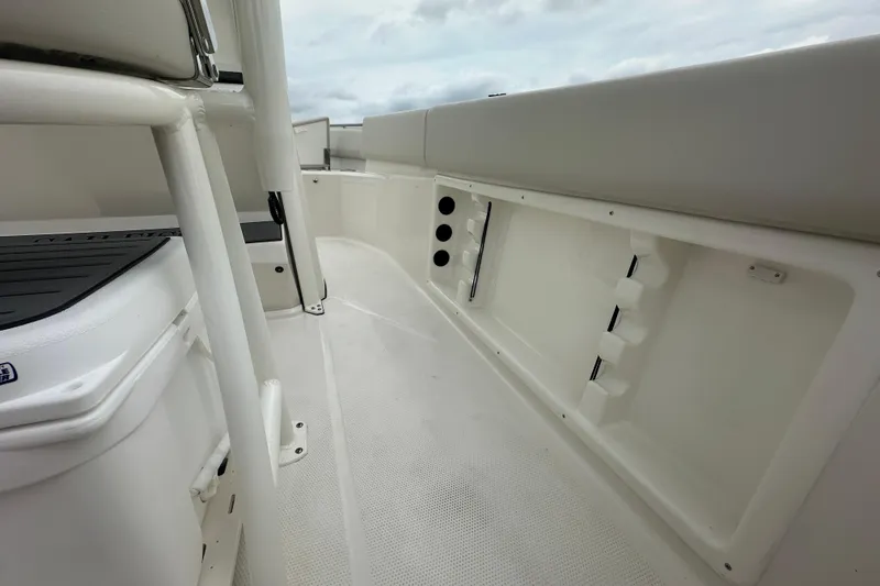 Slide: The Image of 2026 Sailfish 232 CC boat interior, featuring sleek white design and spacious deck layout. - 19