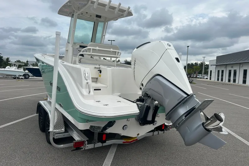 Slide: The Image of 2026 Sailfish 232 CC boat on trailer with powerful outboard motor. - 14