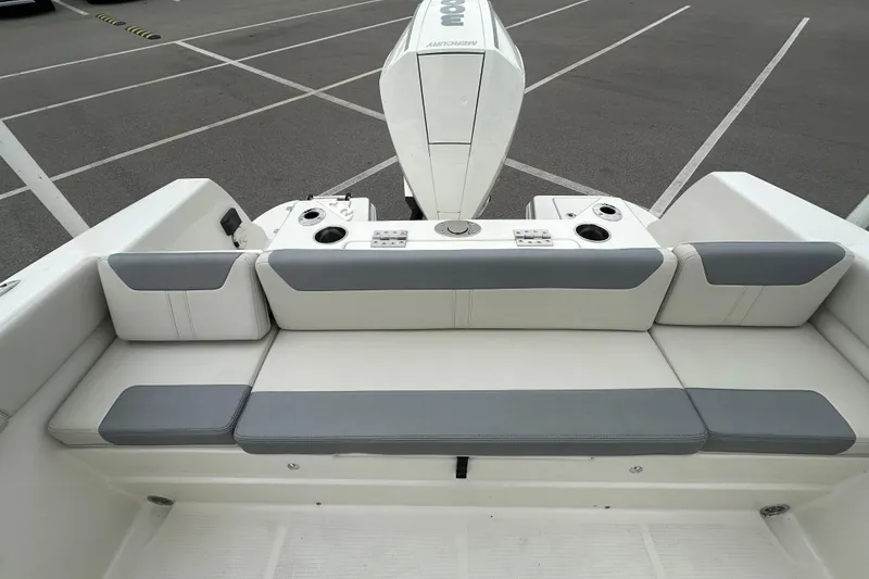 Slide: The Image of 2026 Sailfish 232 CC boat interior with cushioned seating and engine view. - 30