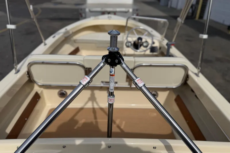 Slide: The Image of 2027 Rossiter 14 boat interior with steering wheel and seating, showcasing sleek design. - 12