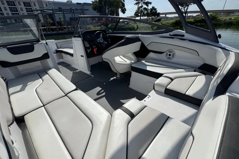 Slide: The Image of 2018 Yamaha Boats AR210 interior with spacious seating and modern design. - 19