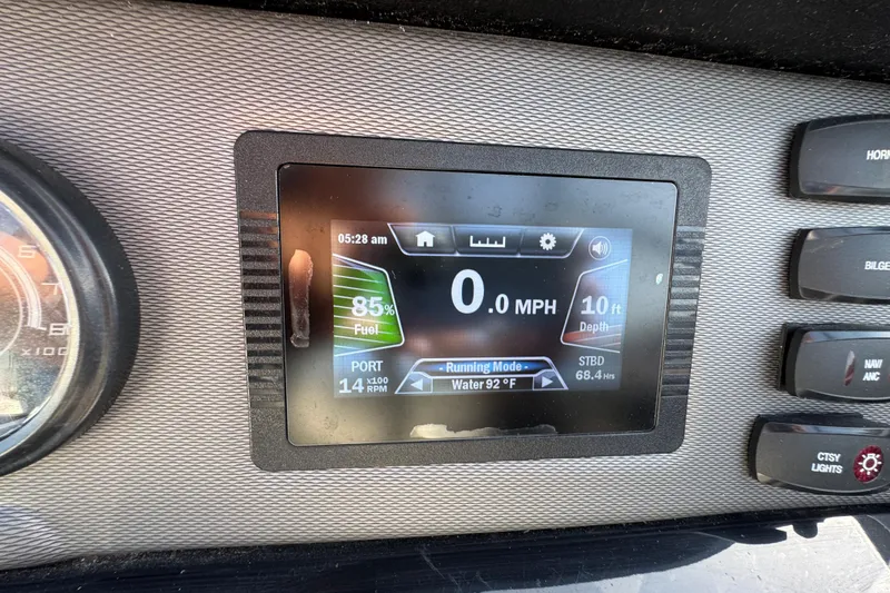 Slide: The Image of Dashboard display of a 2018 Yamaha Boats AR210 showing speed, fuel, and depth. - 18