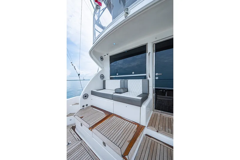 Slide: The Image of 2009 Riviera 58 Flybridge yacht with elegant seating and teak flooring. - 72
