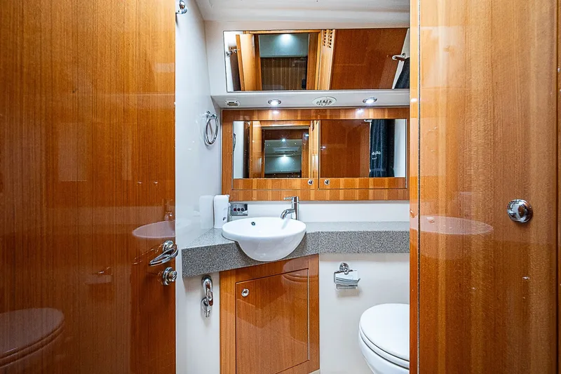 Slide: The Image of Luxurious bathroom interior of 2009 Riviera 58 Flybridge yacht with wood finish and modern fixtures. - 36