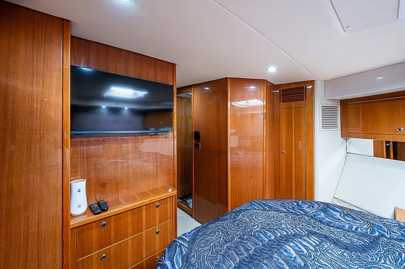 Slide: The Image of Luxurious interior of 2009 Riviera 58 Flybridge yacht with wood paneling and modern amenities. - 37