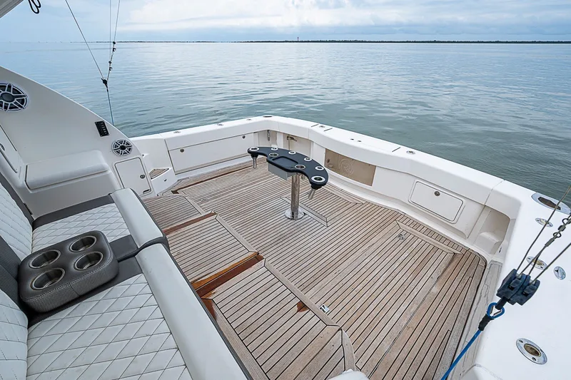 Slide: The Image of 2009 Riviera 58 Flybridge yacht deck with seating and ocean view. - 71