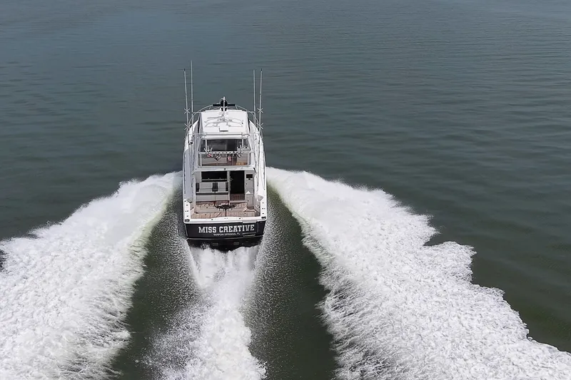 Slide: The Image of Aerial view of 2009 Riviera 58 Flybridge yacht cruising on open water. - 106